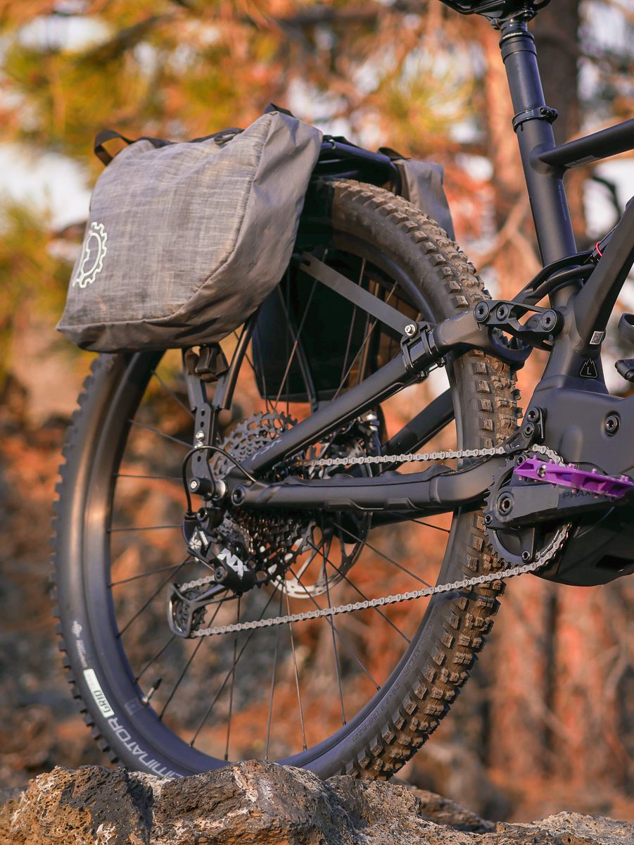 Pannier rack on the back of an emtb with revelate designs panniers