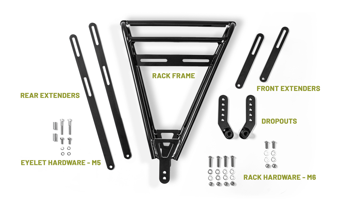 Old Man Mountain Divide Rack with all of the parts it ships with laying on a white backdrop