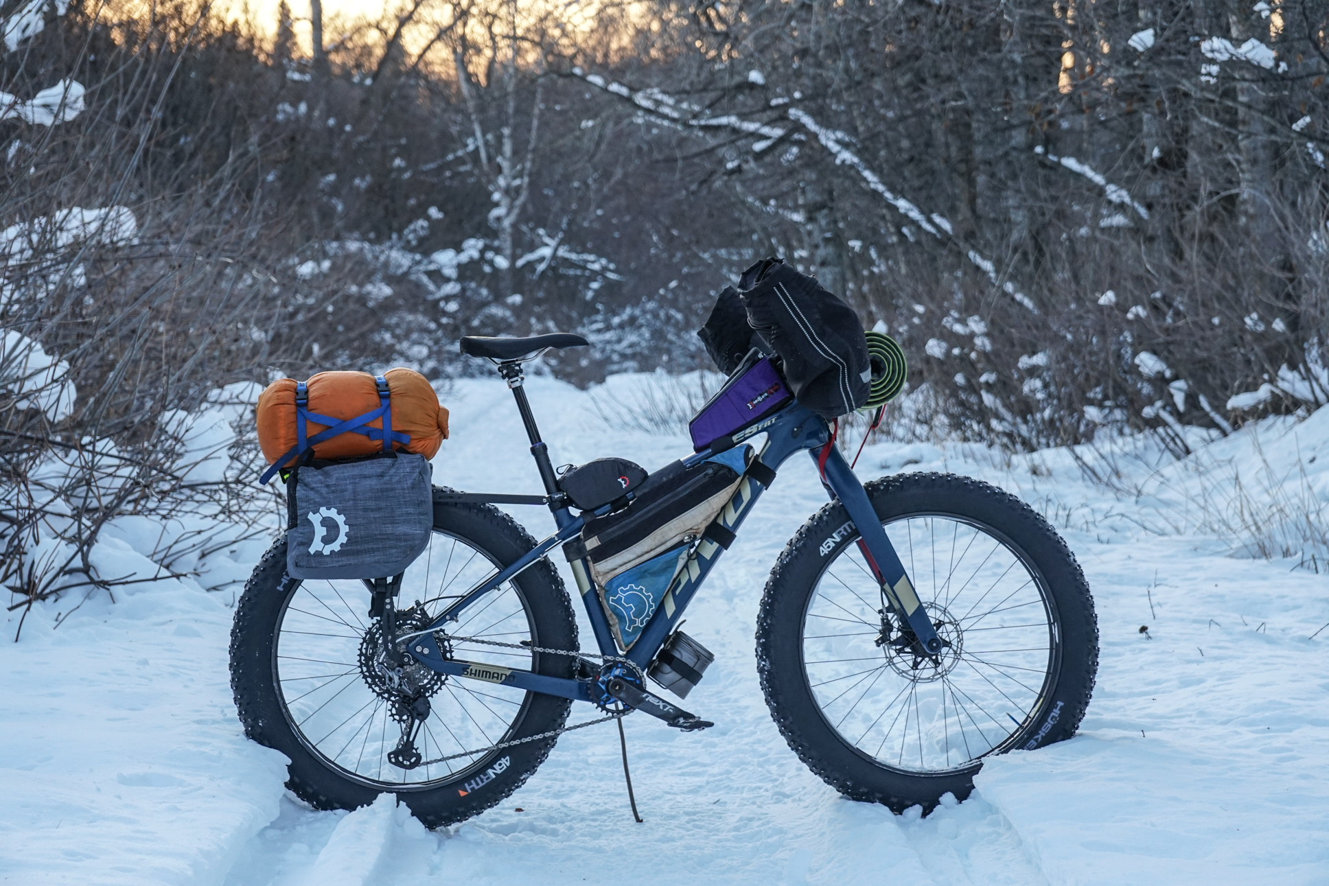 Kurt's bikepacking setup in the snow in Alaska with a Divide Fat rack