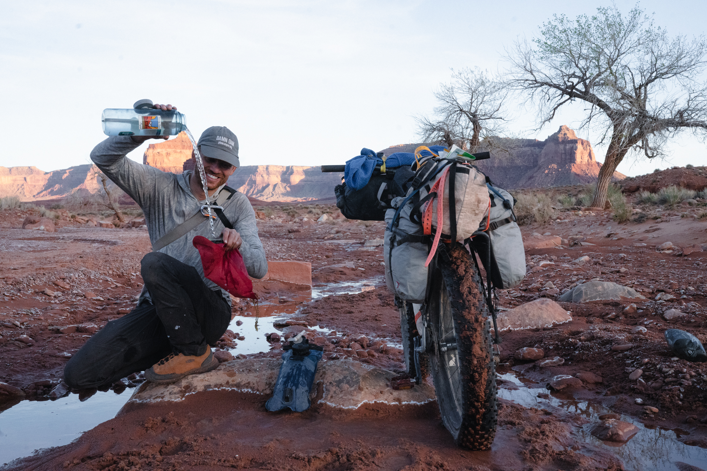 Steve gathering water at camp during his bikepacking trip