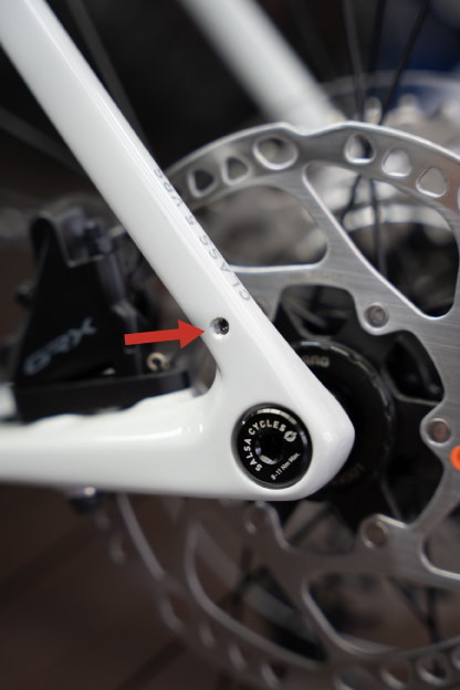 A carbon frame with a bonded in eyelet made for fenders.