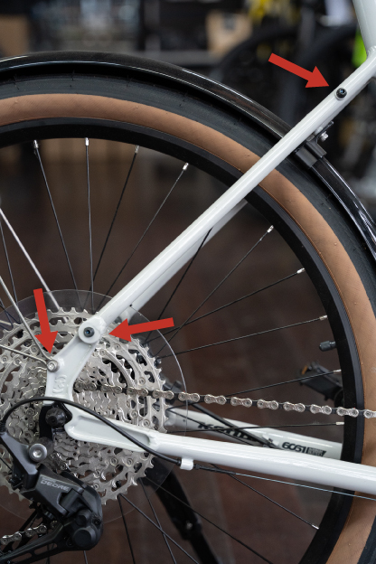 An aluminum bike frame with upper and lower eyelets for fender and rack mounting.