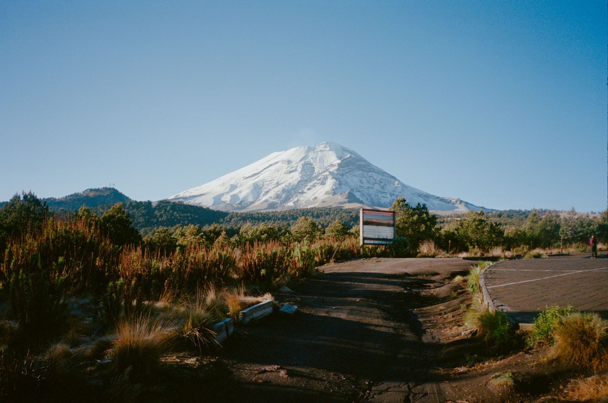 Bikepacking landscape with a snow capped peak in the background.
