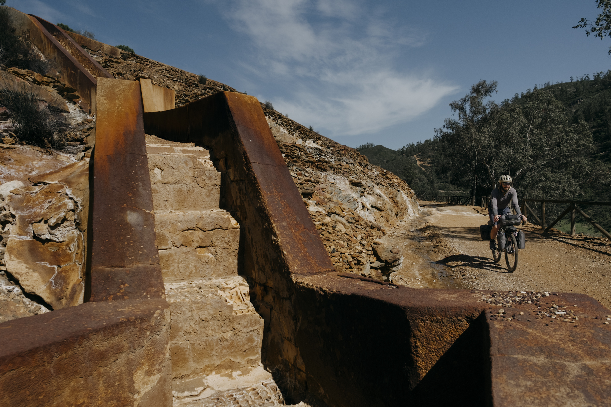 Angustias_Tour_TomasMontes-11 Javi pedaling past mining ruins.