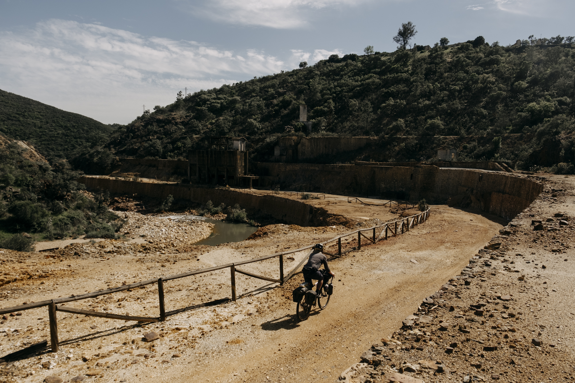 Angustias_Tour_TomasMontes-45 Javi pedaling through mine ruins.