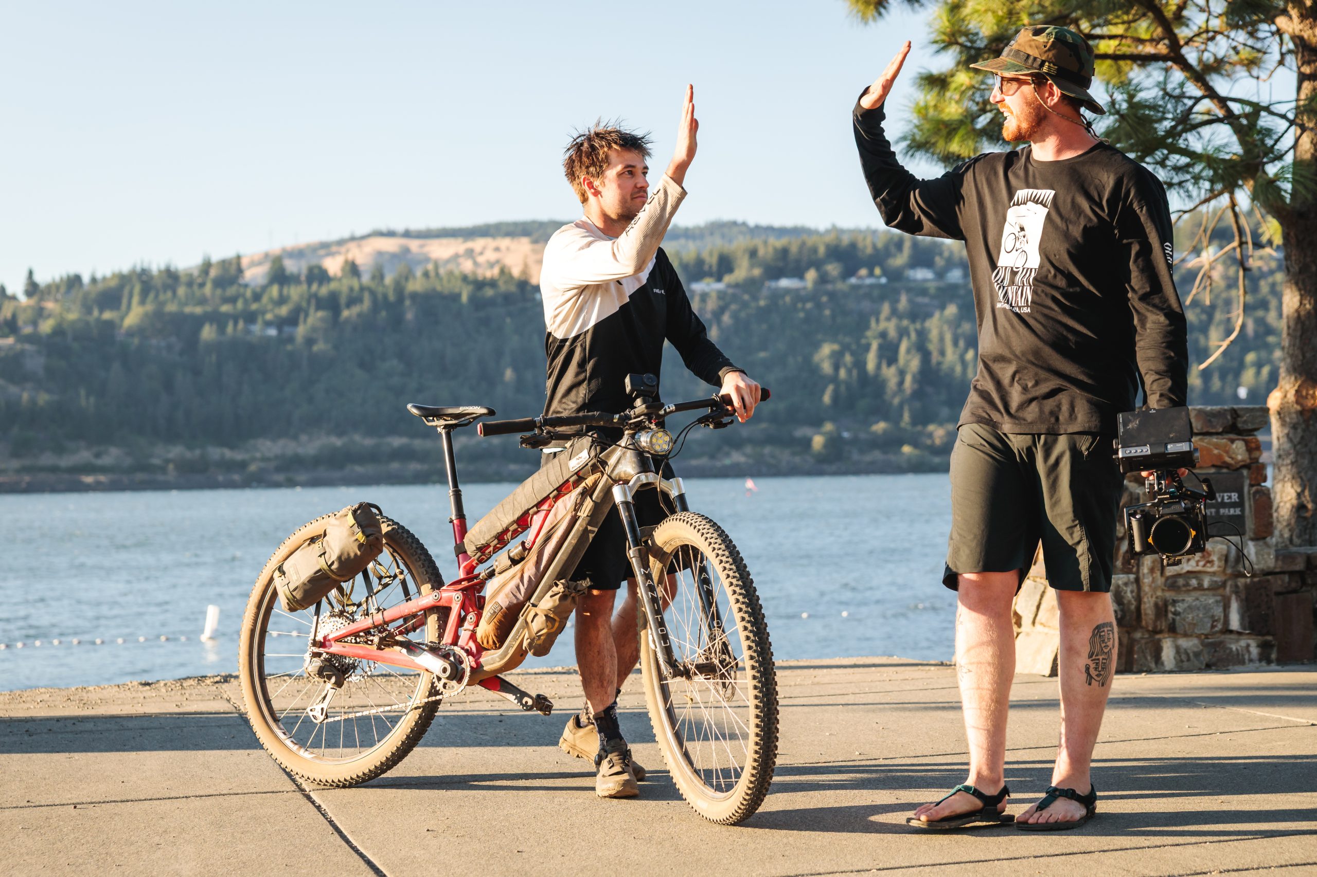 Alex and Zach high-fiving at race finish